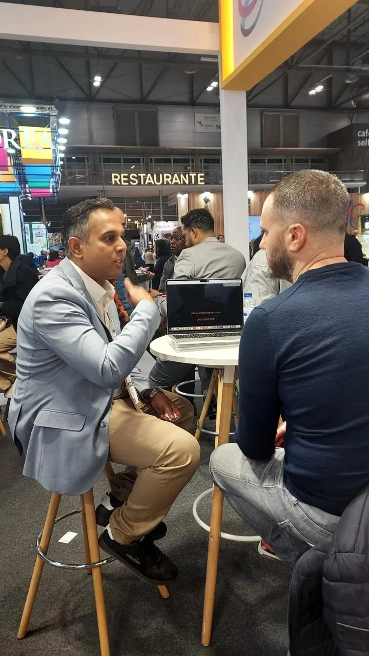 Travel representatives in conversation at an exhibition stand
