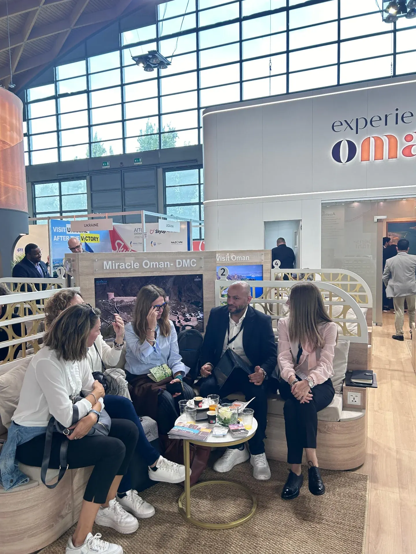 Travel partners gathered at an Oman exhibition stand