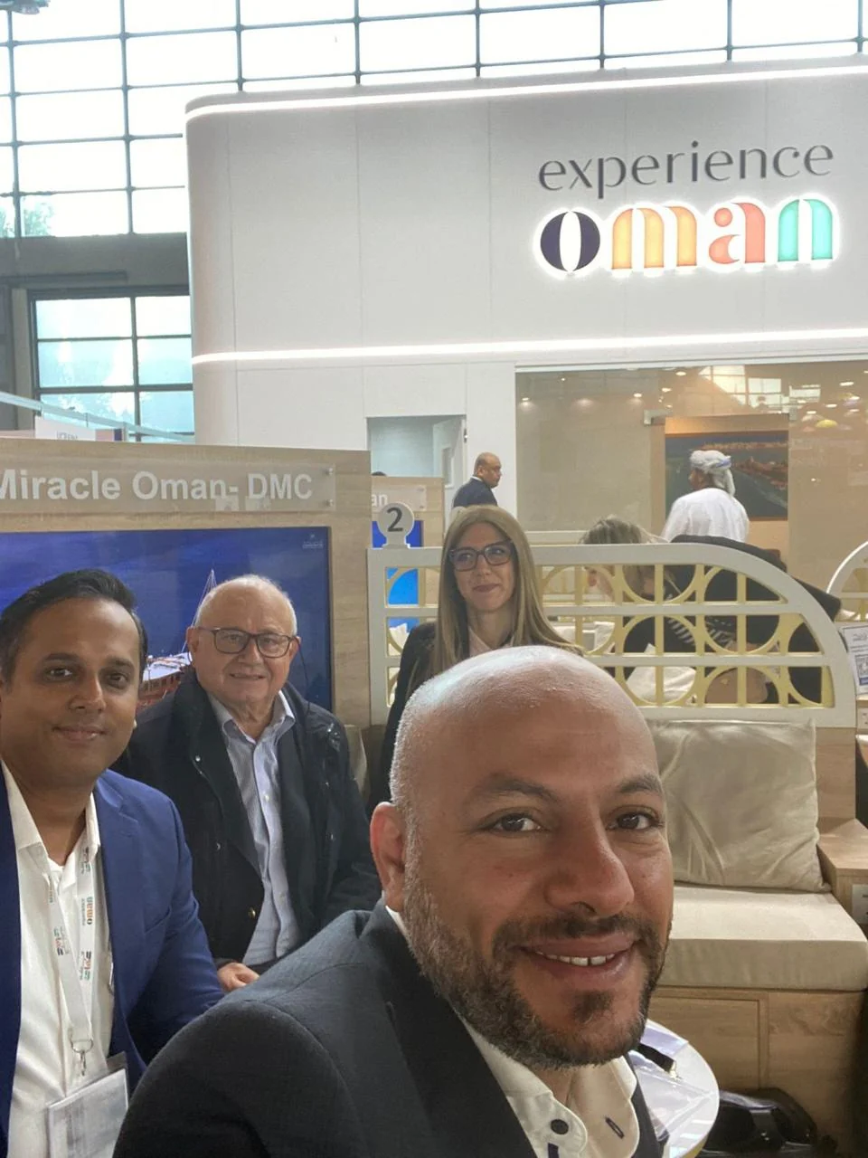 Delegates taking a photo at the Experience Oman stand